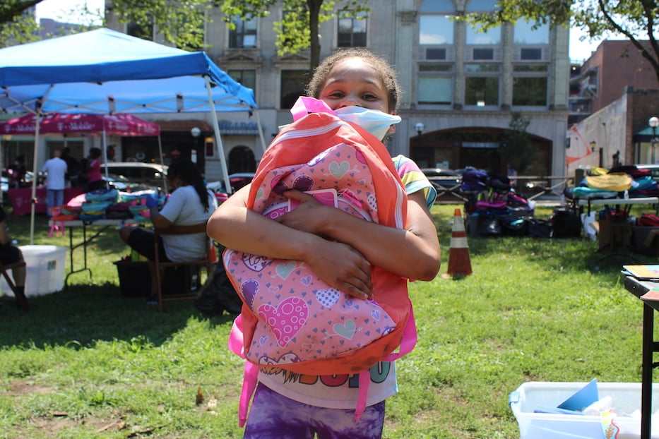 Jaylin holding her new bookbag