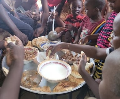 Kutti Dagoum having breakfast with family in Sudan