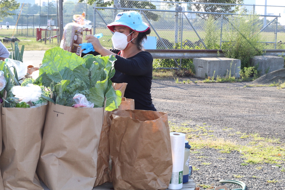 Marina Morocho, A Community Health Ambassador, packing weekly deliveries.
