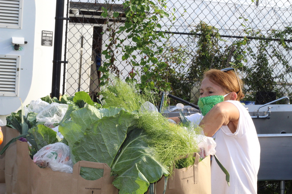 Ruth Torres, the Community Health Ambassador Coordinator, packing weekly deliveries.