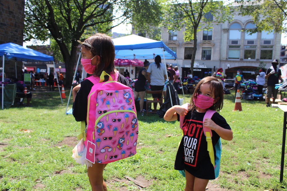 Magdalena and Gabriela show off their new bookbags