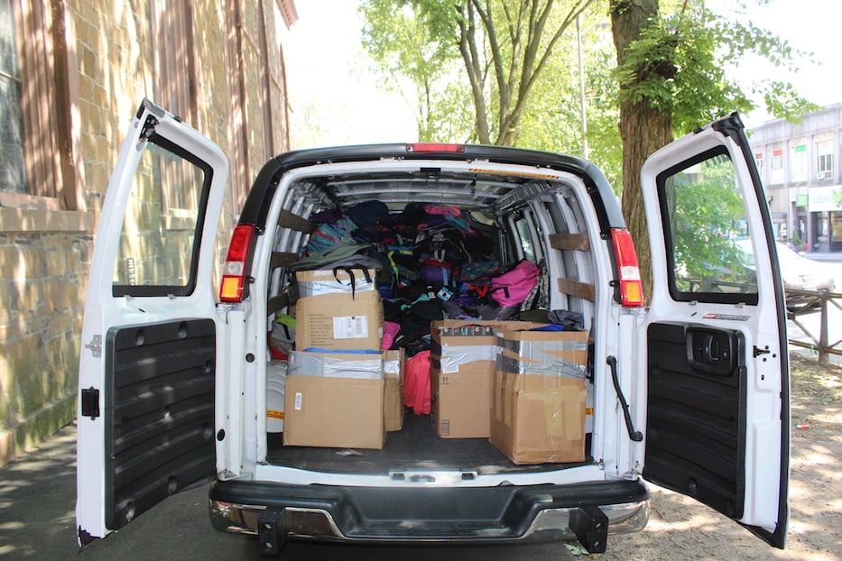 The Uhaul van filled with roughly 700 bookbags