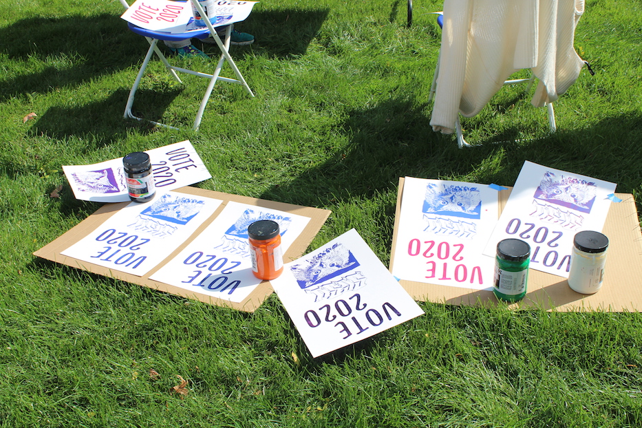 A group of completed poster drying in the sun
