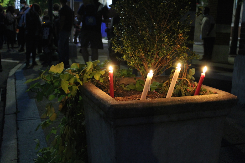 Candles lit as offering on Sherman Avenue