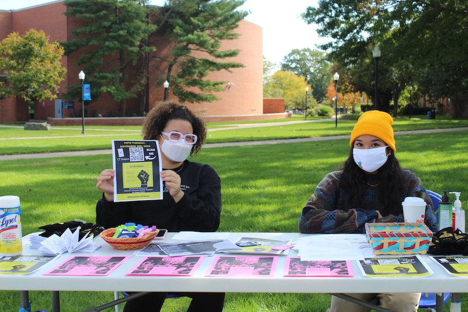 Gabrielle Ferrell and Marie Perez registering voters and passing out materials