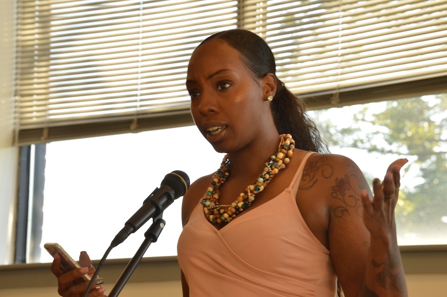  New poet Shavon Gales takes the mic with her phone. In an interview after she read, Gales said that she and Driffin know each other from attending the same church for two years.  