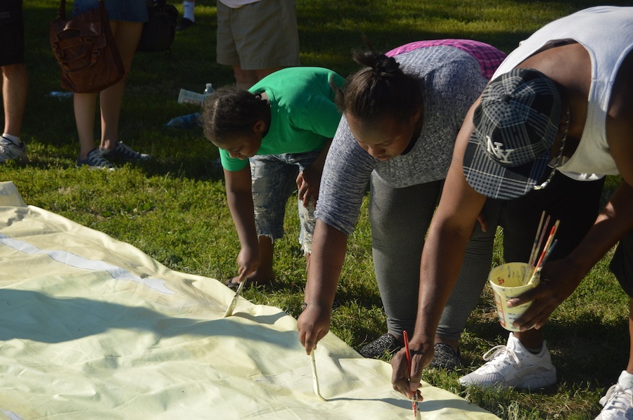  Community member Michael (he declined to give last name), and daughters his Alonna Reid and Deanaya Leon. 