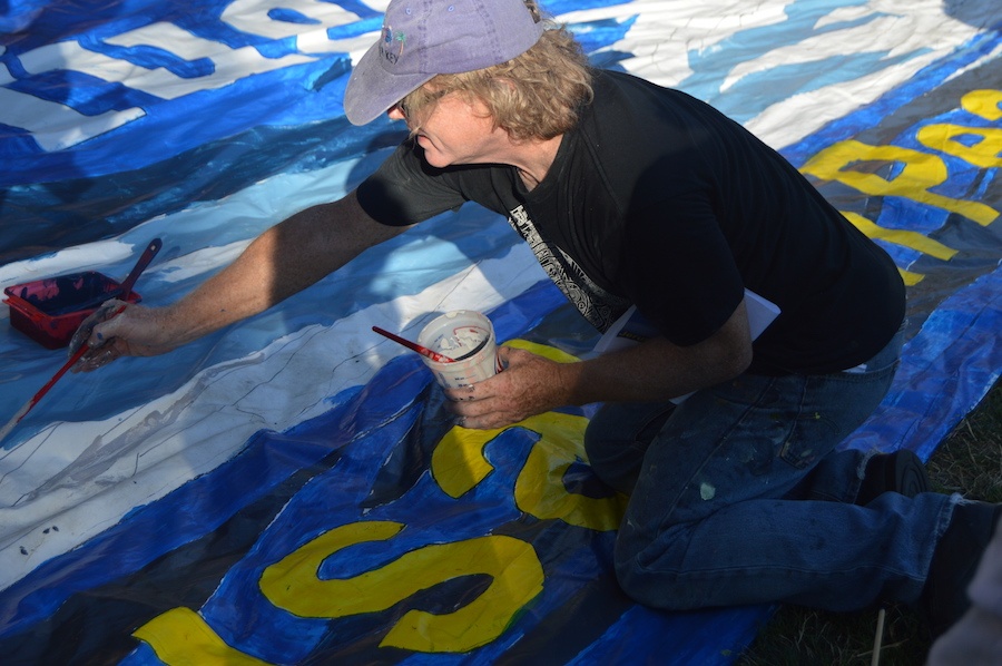 Russell Rainbolt painting some of his own design