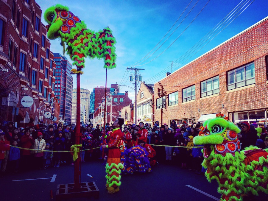 Dancers from the Wan Chi Ming Hung Gar Institute Dragon and Lion Dance Team stunned during the parade. Toward the end, one scaled a pole to