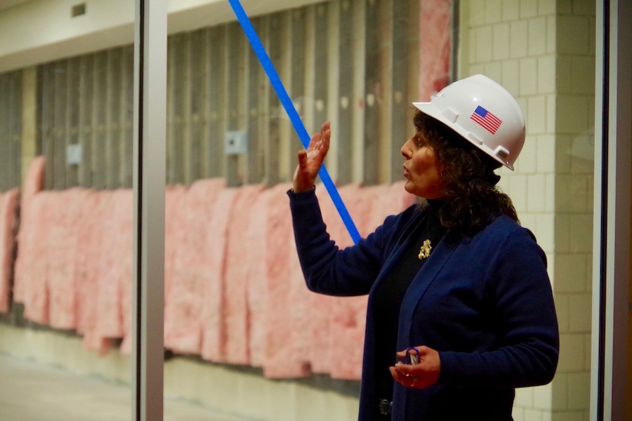 Judy Alperin, CEO of the Jewish Federation of Greater New Haven, led a tour of the permises earlier this week. The room to which she's gesturing will soon be a fitness center and TRX climbing wall. Lucy Gellman Photo.