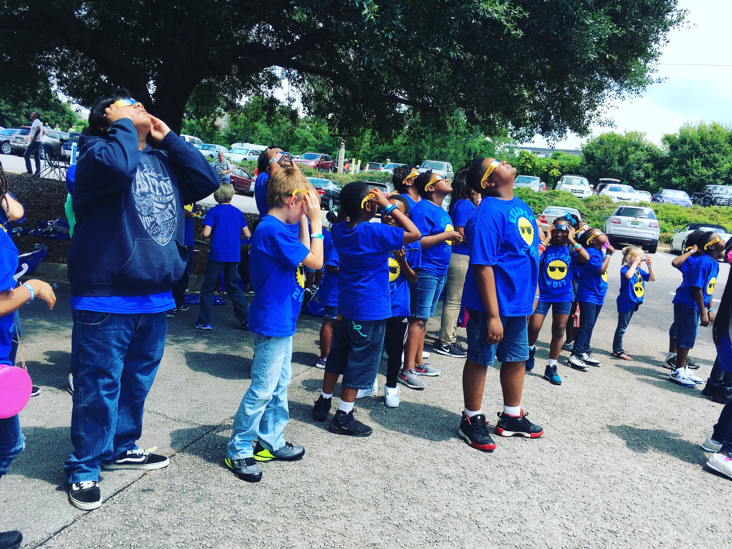  A school group looks on as the eclipse begins in Columbia, South Carolina. Lucy Gellman Photo. 