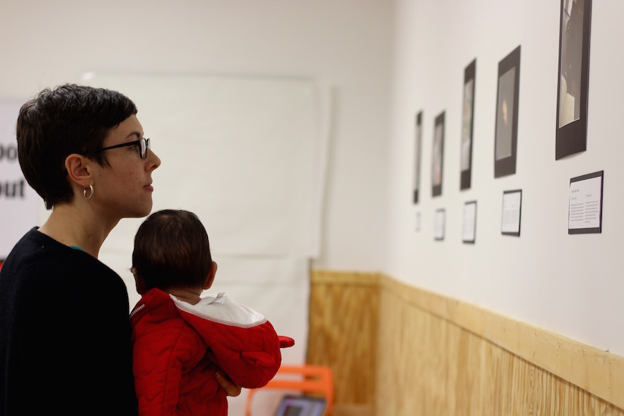  Graduate student Megan Fountain, a longtime activist with and member of ULA,  takes in the exhibition.  