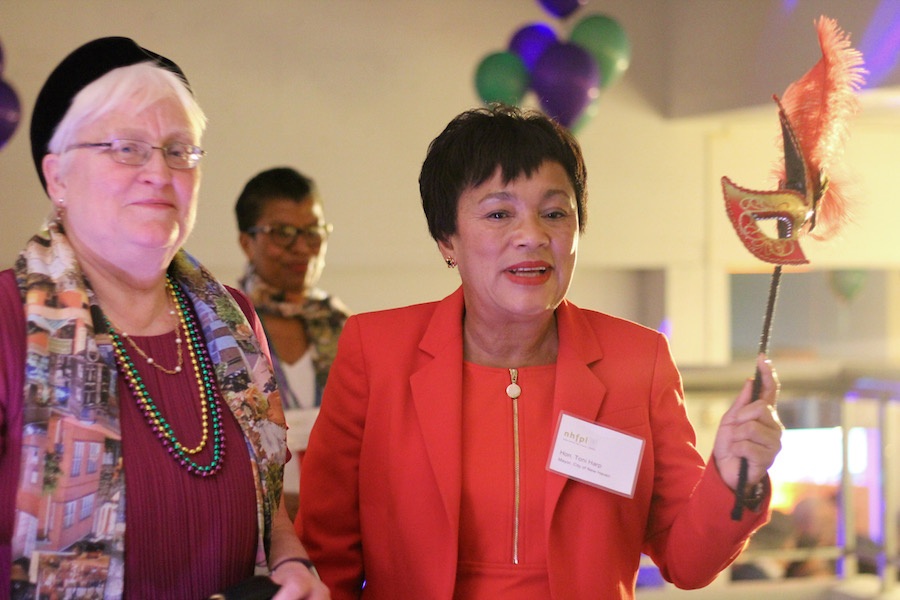 City Librarian Martha Brogan and Mayor Toni Harp follow a parade of drag queens and musicians to the party downstairs.