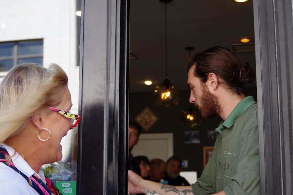 Robert Savran mans the grill with one side of his brain and checkout with the other.
