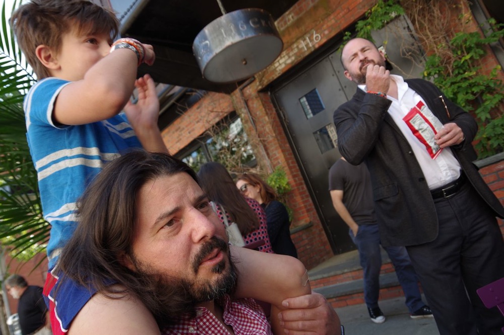 John Ginnetti with his son Jack. Bruce Ditman in the background.