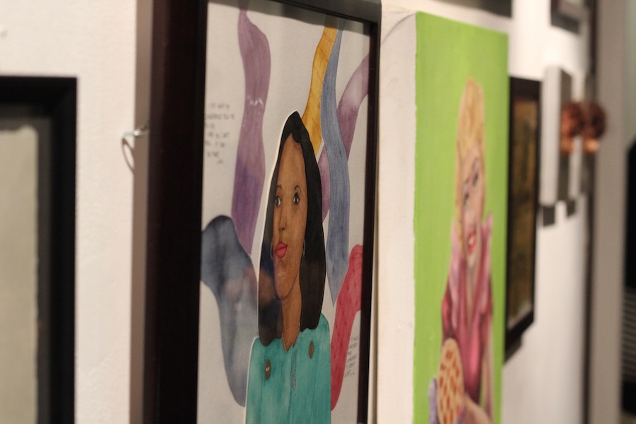 Gabriella Svenningsen’s delicate watercolor of Angela Davis is one in a packed hallway of eye-catching work.