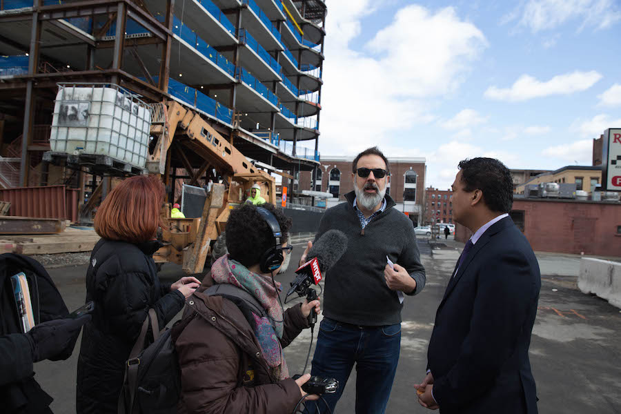  John Dankosky interviews Mike Mathis of MGM at the construction site of a resort casino in downtown Springfield, Mass. NEXT Producer Andrea Muraskin records the conversation. Photo by Ryan Caron King for NENC.  