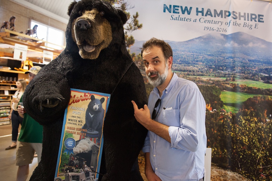  John Dankosky poses with a new friend in the New Hampshire Building at the Big E. Photo by Ryan Caron King for NENC 