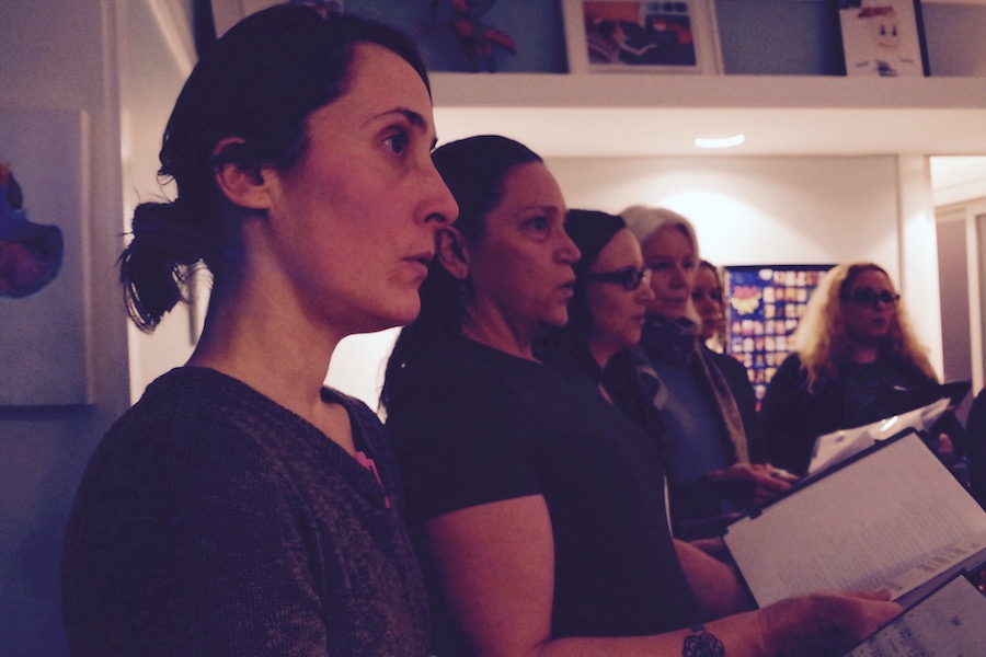  Artist Ana Henriques, with members Shirley Louise-May, Catherine Bailey, and Ann Wiley in the background. Lucy Gellman Photo.  