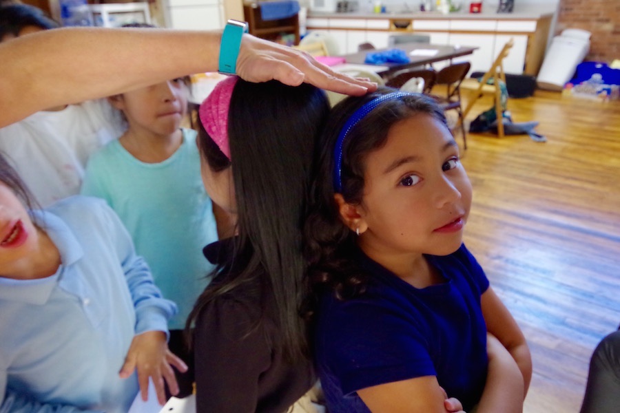  Students Ashley Chen and Mei-Lin Nunez compare heights during a short break in their 