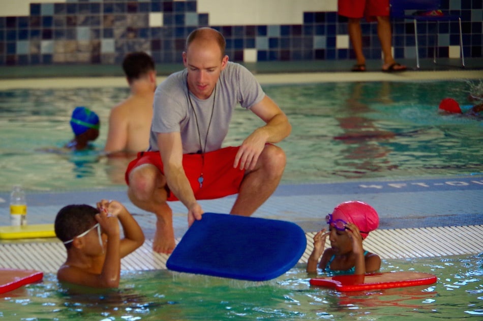 Instructor Brian Coppage with two students. Coppage, who has been teaching for over seven years, is now the head teacher/lifeguard on duty at John D. Martinez.