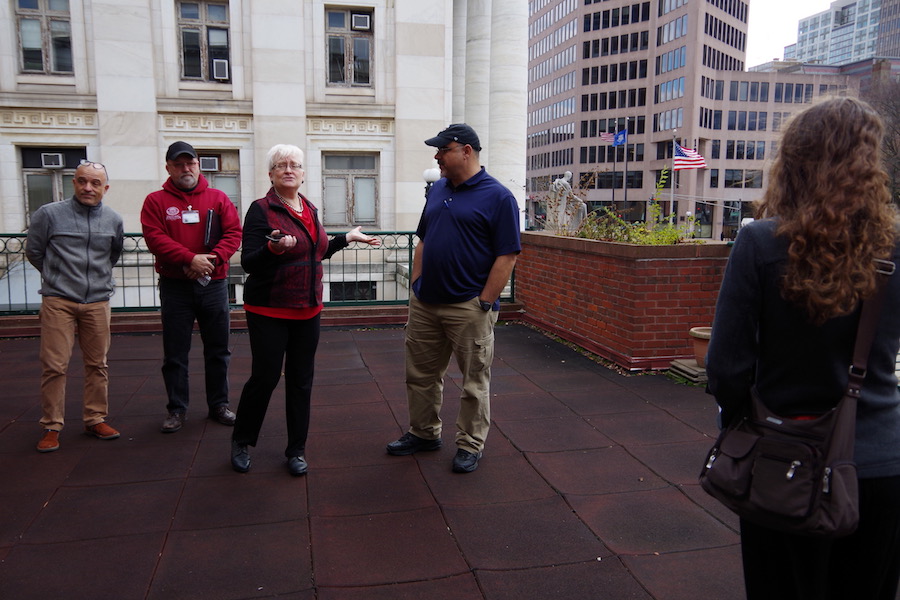  City Librarian Martha Brogan out on the library's Ives Branch patio, which faces out toward Elm Street and gives an elevated view of the city. Lucy Gellman Photos.  