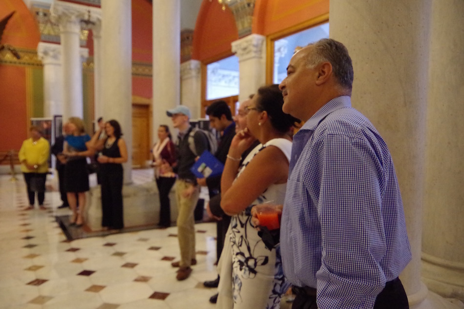 Couple Ruben and Nancy Serrano lean in for remarks.