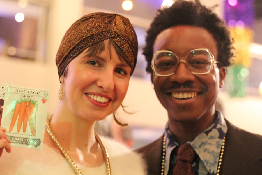 Katie Jones and artist Kwadwo Adae sporting some newly-scored carrot seeds ... and gilded attire.