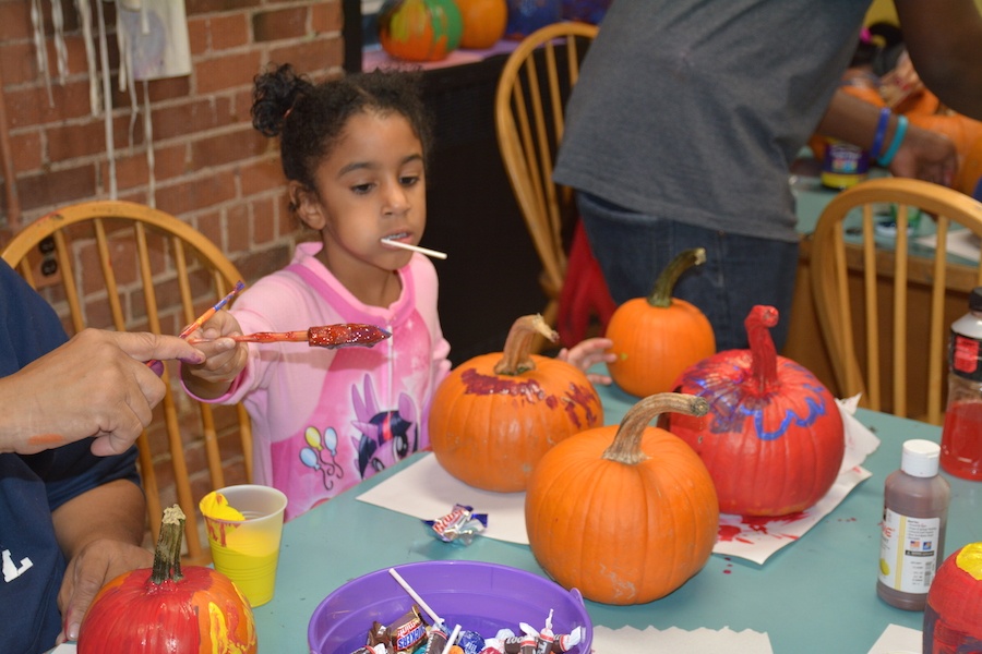  A LEAPer paints pumpkins donated by Melillo's Greenhouse and General Store in North Branford.  