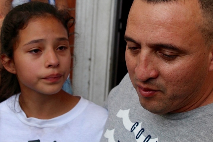  Marco Antonio Reyes Alvarez with his daughter earlier this week at the church. Christopher Peak photo.&nbsp; 