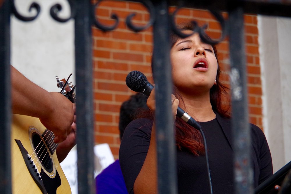  A vigil held Sunday evening featured music in English and Spanish. Lucy Gellman photo. 