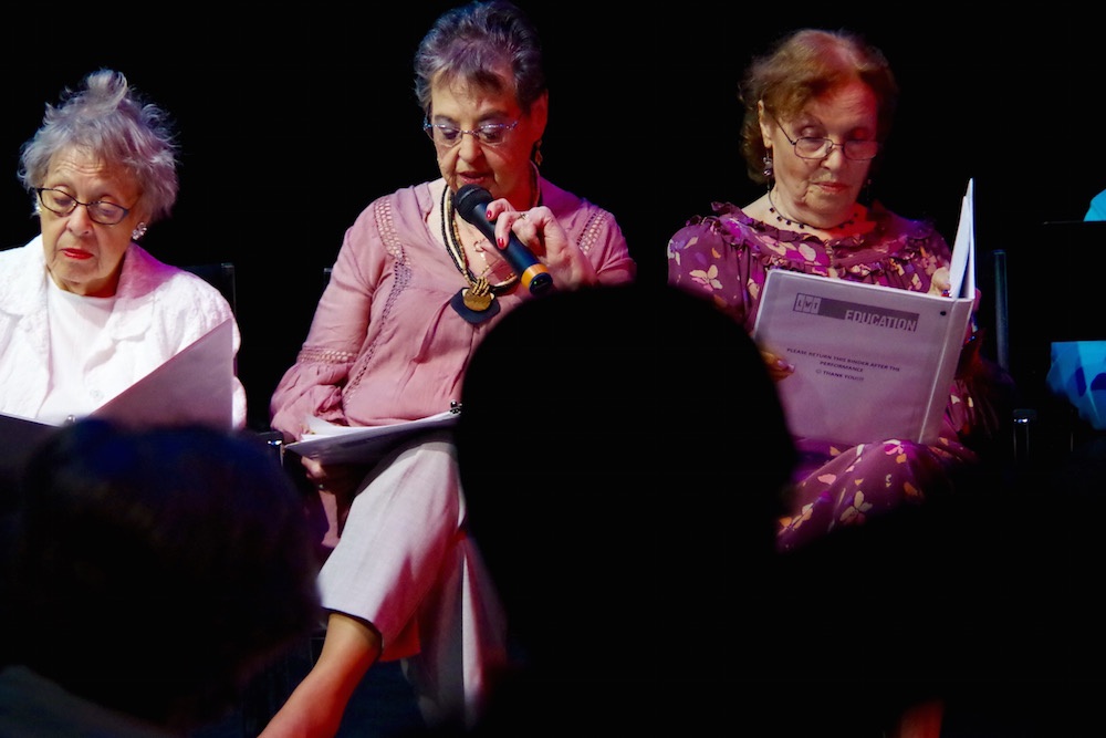  Terry Berger, Elaine Feldman (on mic) and a reader for Ruth Maxim. 