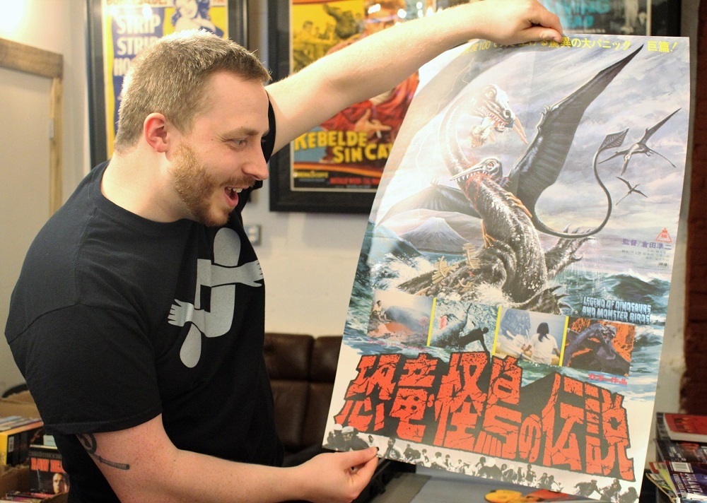 Upson shows off a kaiju one sheet.