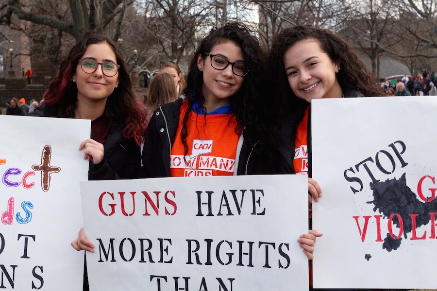  From Meriden, 15-year-olds Elizabeth Pasion, Tatyana Maldonado, and Jailine Carrero stopped for a moment to pose around Maldonado, whose sign read “Guns Have More Rights Than My Vagina.”  