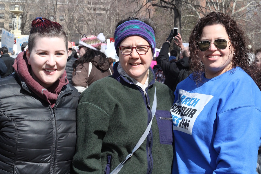 Jo Schaller (at center), with new friend Elizabeth Brown, a 23-year-old student, and longtime friend Marisol Feliciano, who works in trauma at St. Francis Hospital.