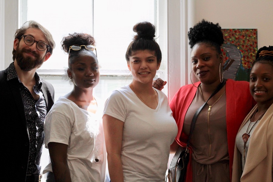 Gina Martin (in pink sweater), with Youth Art Project participants Yanilie Maldonado and Lekisha Jacques and Marrakech Inc. employees Alexzandria Dowdy and Matthew Horowitz.