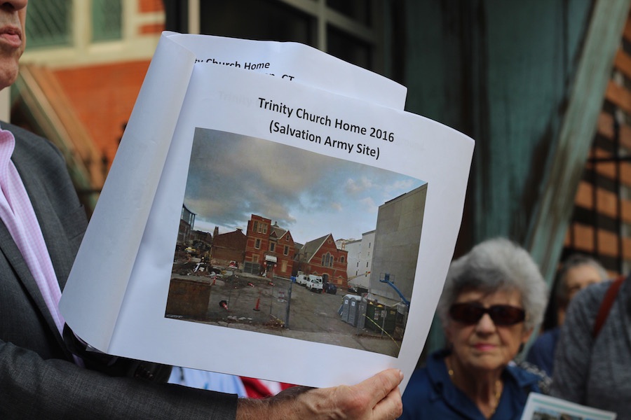 Gardner shows members images of the old Salvation Army buildings. While the chapel remained for historic preservation, the home was torn down by Metro Star Properties.