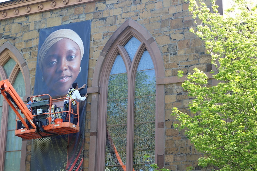  32 immigrants and refugees will arrive on the New Haven Green this week, and remain there through August. You won’t be able to ask them their stories though—that will require a literal closer look. Lucy Gellman Photos.  